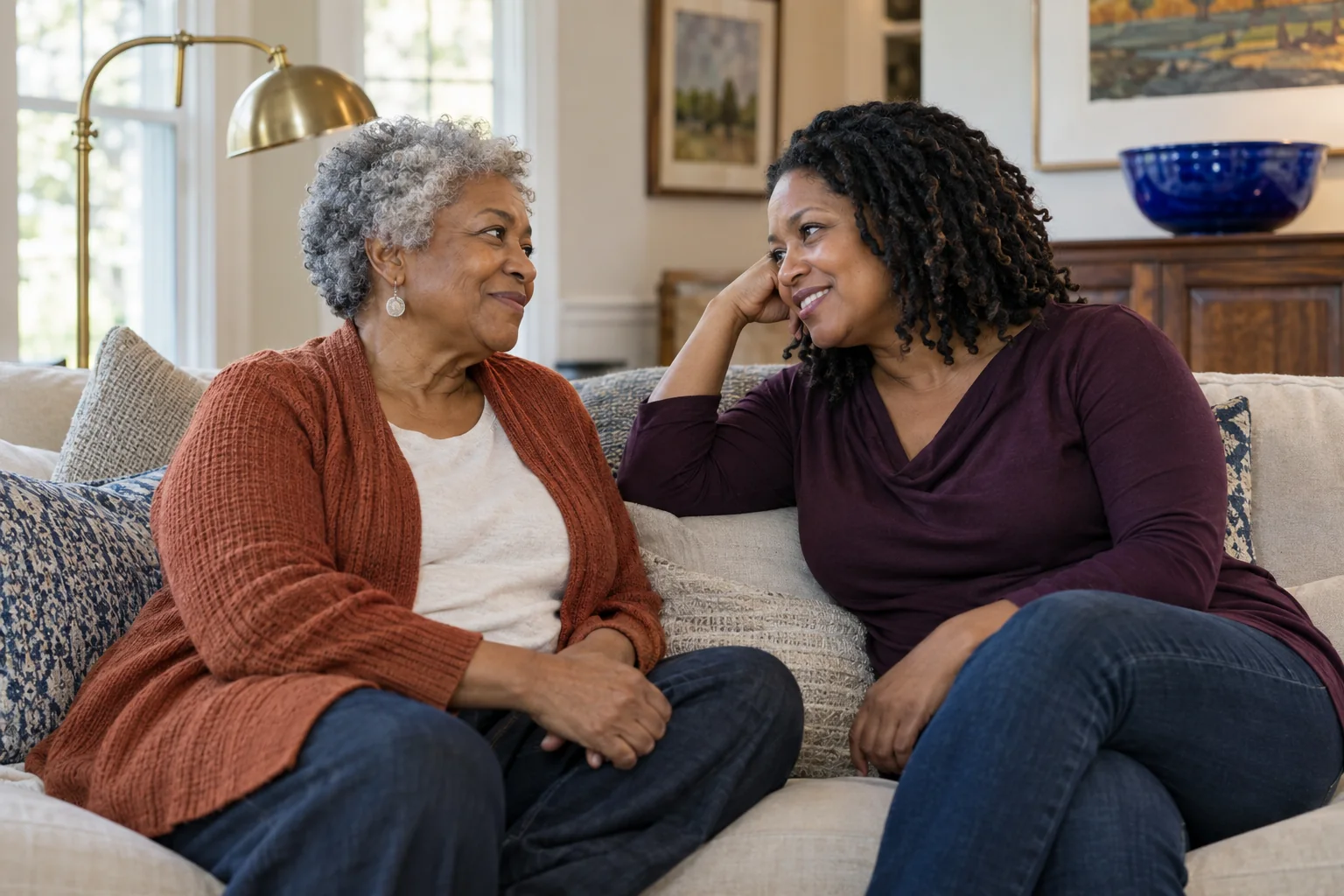 Adult daughter talking with her senior mother about home safety at home