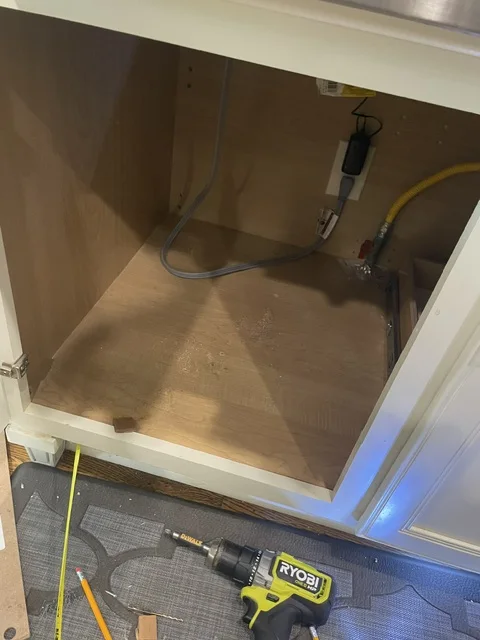 Before — deep base cabinet before pull-out shelf installation